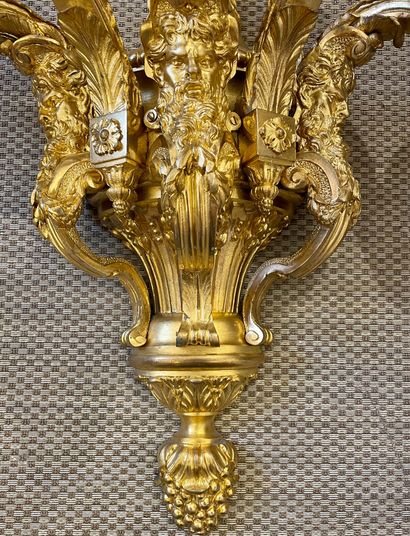 null 
An important pair of ormolu and chased bronze sconces with five moving light...