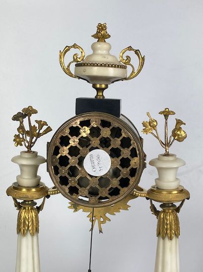 null A white marble and gilt bronze portico hanger with a double twisted column resting...