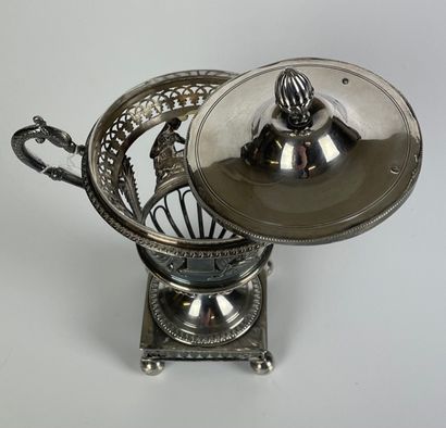 null JAMMER covered in chased and openworked silver on a pedestal. Square base on...