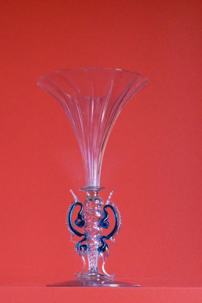 null GLASS with hollow leg with several ribbed bulges and blue fins . Vertical ribbed...