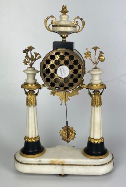 null A white marble and gilt bronze portico hanger with a double twisted column resting...