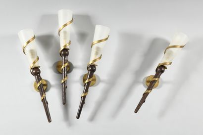 null WORK OF THE 1980's Suite of four wrought iron "torch" wall lights with gold...