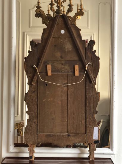 null Large MIRROR with gilded wood moulded and carved with foliage and vine leaves,...