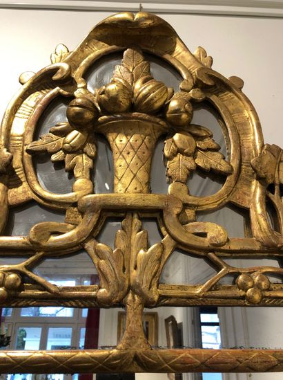 null Large MIRROR with gilded wood moulded and carved with foliage and vine leaves,...