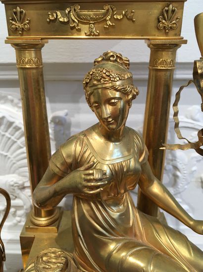 null PENDULE en bronze doré représentant une jeune bergère et son mouton pansant...