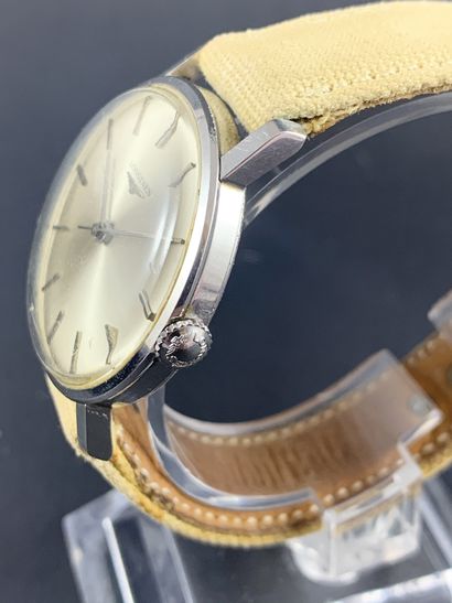 null LONGINES About 1970. Steel wristwatch, round case, grey dial signed. Silvered...