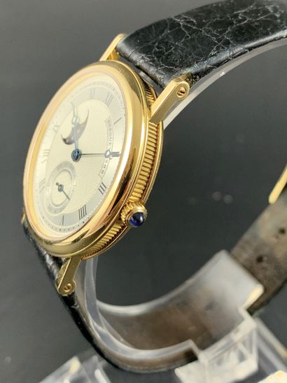 null 
BREGUET 3300BA Moonphase About 2000/2010. Ref: 4269A. 18K yellow gold bracelet...