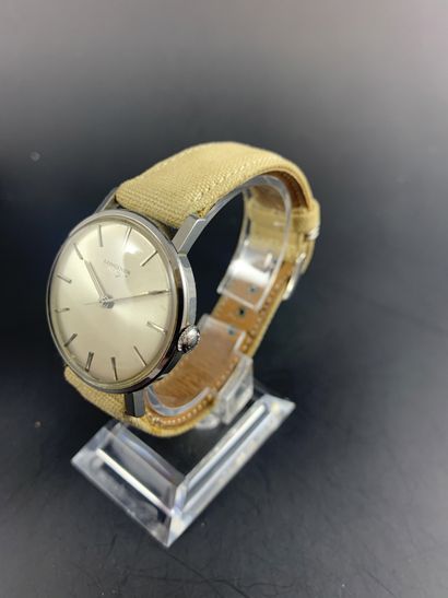 null LONGINES About 1970. Steel wristwatch, round case, grey dial signed. Silvered...