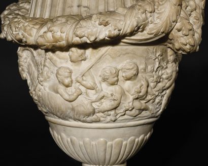 null A MEDICIS SHAPED MARBLE VASE, the body decorated with a bacchanal, resting on...