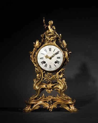 null Gilt bronze clock decorated with foliage and rocaille, the dial with Roman and...