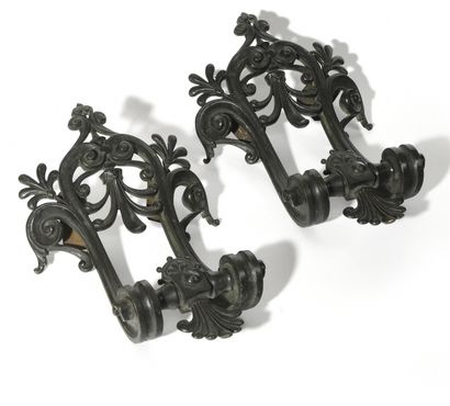null PAIR OF BRONZE ELEMENTS with green patina and openwork palmettes, probably former...