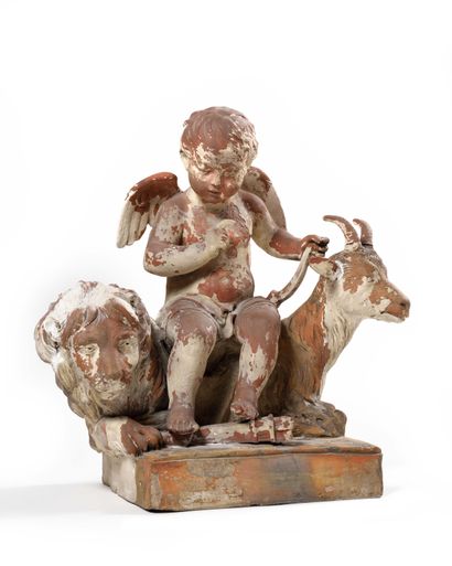 null A painted terracotta group (traces of paint) representing Cupid accompanied...