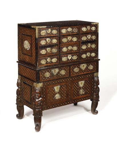 null A teak and ebony and bone marquetry CONTADOR with fifteen drawers, brass handles,...