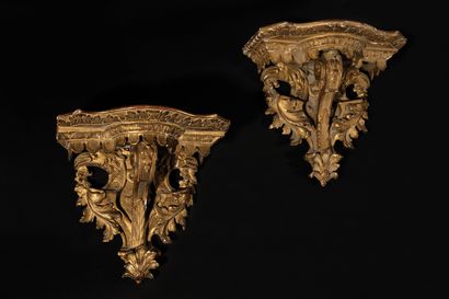 null TWO SMALL Gilded wood console tables, the moving top resting on a scrolled upright,...
