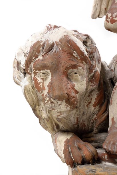 null A painted terracotta group (traces of paint) representing Cupid accompanied...