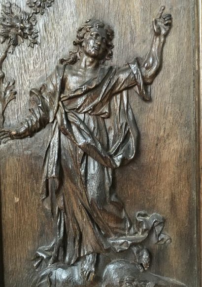 null A moulded oak wood panel with relief carving of St John. Late 16th century (total)...