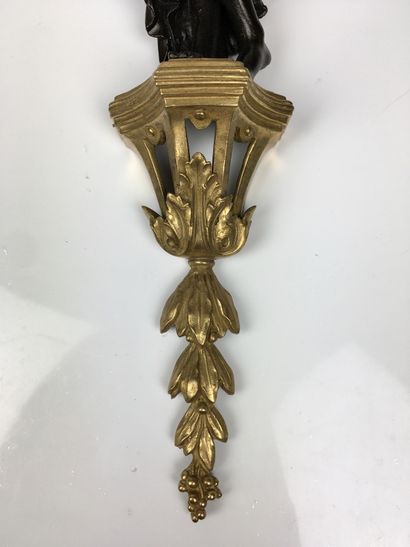  A Pair of ormolu and patinated vestal sconces with two moving light arms decorated...