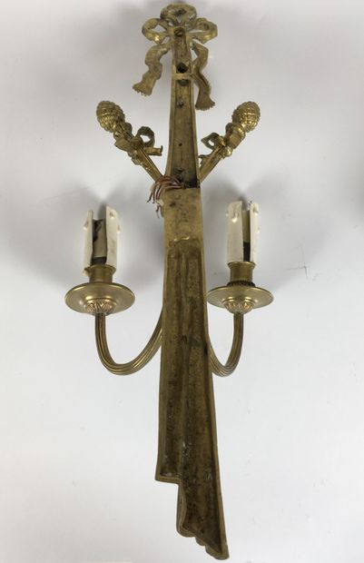 null A Pair of gilt bronze two-light sconces decorated with pine cones and a knot,...