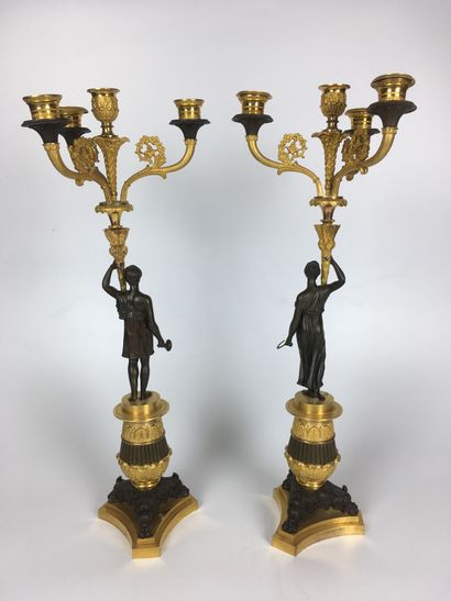 null A PAIR OF CANDELABRES in gilt and patinated bronze with three arms of lights...