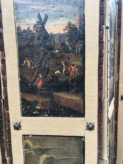 null PARAVENT à cinq volets ornés de dix toiles à décor de paysages flamands du XVIIIe...