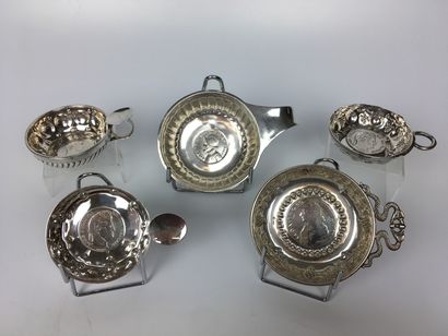 FIVE silver TASTEVINS, all decorated at the...
