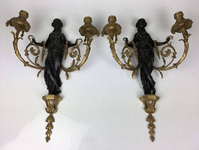  A Pair of ormolu and patinated vestal sconces with two moving light arms decorated...
