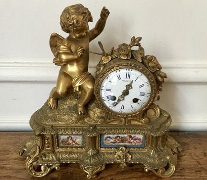 An ormolu and chased clock decorated with...