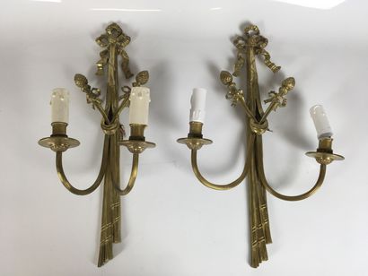 A Pair of gilt bronze two-light sconces decorated...