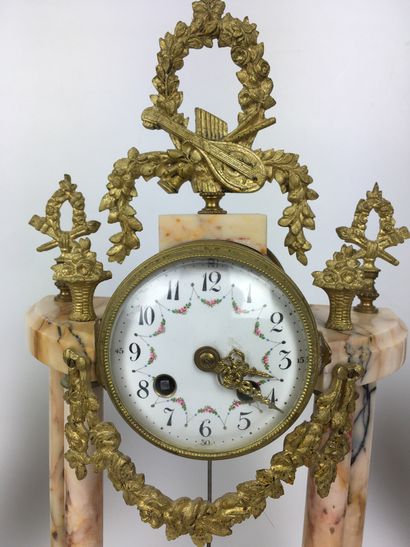null A pink marble and brass CHESTWORK comprising a portico clock with four columns,...