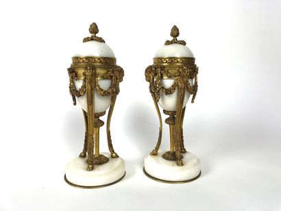 A Pair of ormolu and white marble candlesticks...