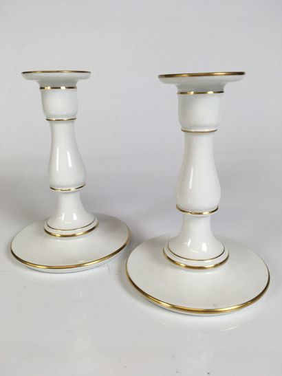 null SEVRES Pair of white porcelain candlesticks with gold nets. Stamped on the back...