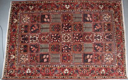 null BAKTIAR JAHAD RUG (Iran) Decorated with garden boxes, red main border with flowers...