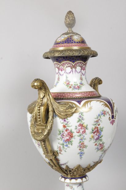 null "Large covered porcelain vase on pedestal with polychrome decoration of garlands...