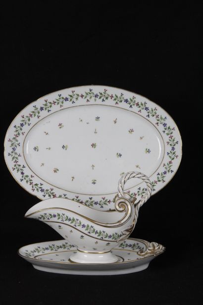 null PORCELAIN LOT, "Barbeaux" decoration and gilded net. A sauceboat with a braided...