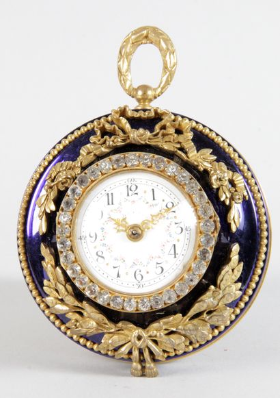 null Gilt bronze and blue enamel CLOCK with chased garlands, bows and pearl frieze...