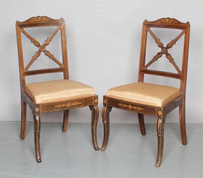 null A Pair of chairs with cross backs, made of rosewood veneer and inlaid with light...