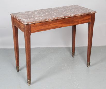 null SMALL MAHOGANY CONSOLE TABLE. It rests on tapered legs with cut sides, finished...
