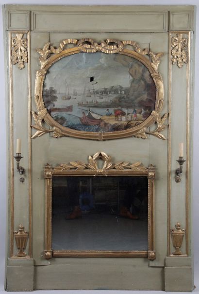 null A grey-green lacquered wood and gilded mirror decorated with laurel wreaths,...