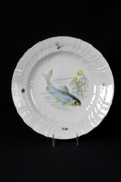 null GERMAN PORCELAIN, BERLIN. Soup plate, with curved edge and bat wing marli decorated...