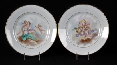 null A PAIR OF WHITE PORCELAIN PLATES with gilded borders and polychrome printed...