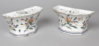 null Pair of Rouen earthenware sconces decorated with polychrome flowering stems....