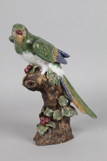 null Polychrome earthenware parrot, resting on a branch. Period, 20th century. H...