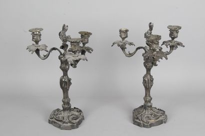 null A PAIR OF CANDELABRES, with three arms of light, in silvered and chased bronze...