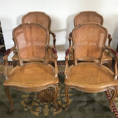 null Suite of four TABLE CHAIRS 

Louis XV style 

In carved wood and cane base 

Armrests...