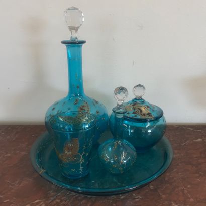 null Lot including :

A five-piece blue enamelled glass night service, decorated...