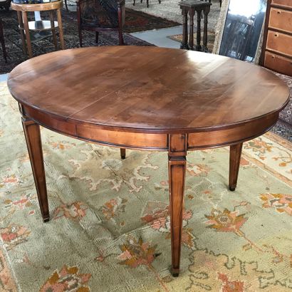 null Oval dining room table 

Louis XVI style in cherry wood, four sheath feet with...