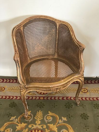 null Caned armchair

Louis XV style

In carved and gilded wood 

Fairly good condition,...