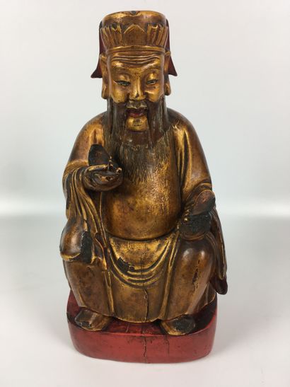 null CHINE Divinité taoïste assise sur un trône en bois sculpté doré, le piétement...