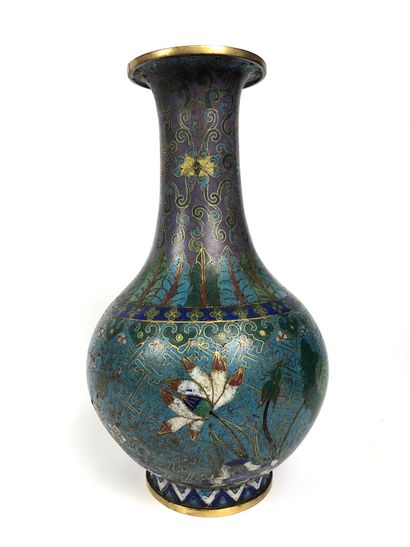  A Chinese cloisonné bronze bottle vase with a long narrow neck and a turquoise background...