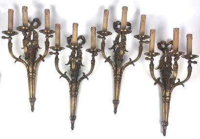 A suite of FOUR ormolu and varnished sconces...